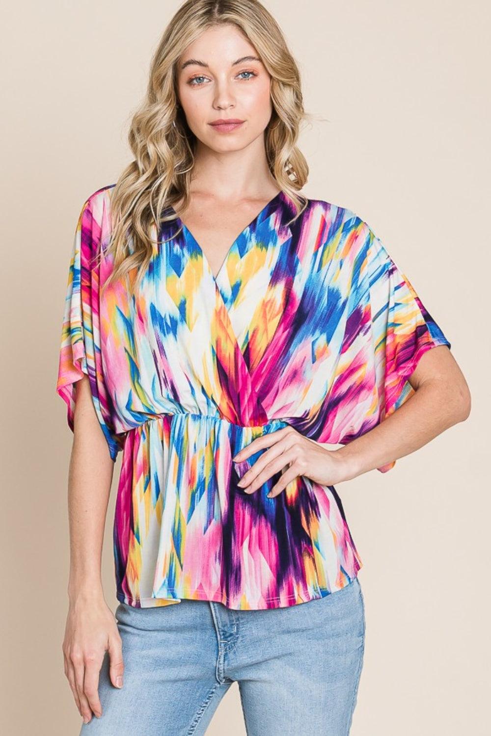 BOMBOM Printed Surplice Peplum Blouse - Abundia House