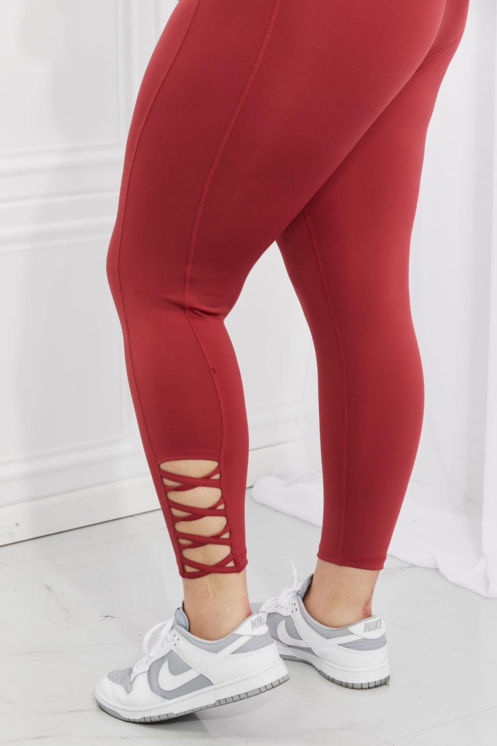 Yelete Ready For Action Full Size Ankle Cutout Active Leggings in Brick Red - Abundia House